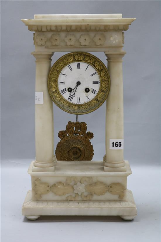 A white alabaster portico clock